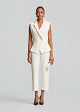 Σταυρωτό γιλέκο με peplum