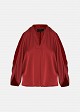 Top with cut-out details and a satin finish