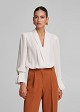 Wrap blouse with lapels in semi-sheer fabric