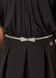 Metallic elasticated belt with bow shaped buckle