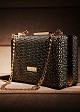 Clutch bag with knitted and metallic details