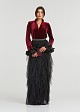 A blouse with a velvet look and feathered cuffs