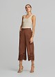 Soft suede-look finish pants and laser-cut accents