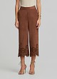 Soft suede-look finish pants and laser-cut accents