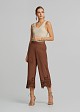 Soft suede-look finish pants and laser-cut accents