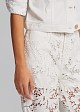 Denim pants in embossed lace