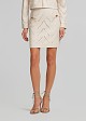Mini skirt in laser cut design and leather look